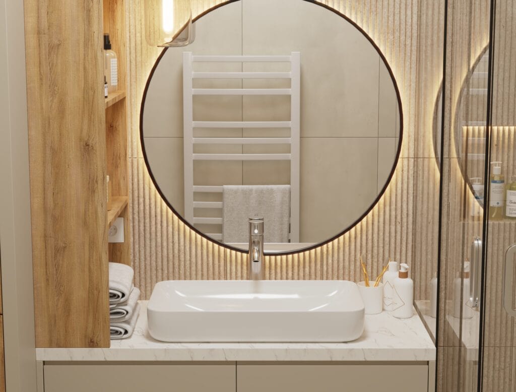 Bathroom sink with round illuminated mirror and wooden details – Intervibe Studio