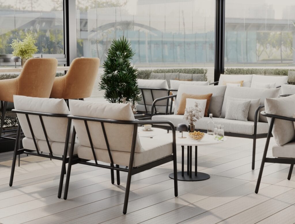 Glass-enclosed café terrace with beige lounge chairs, black frame seating, and modern tables