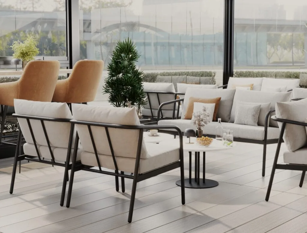 Glass-enclosed café terrace with beige lounge chairs, black frame seating, and modern tables