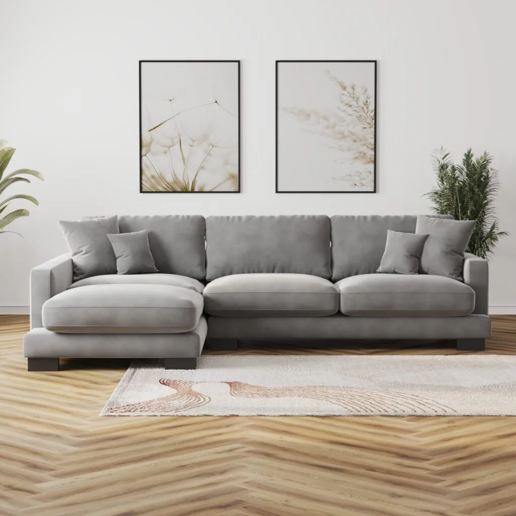 Front view of large grey sofa with cushions in bright modern interior – 3D render