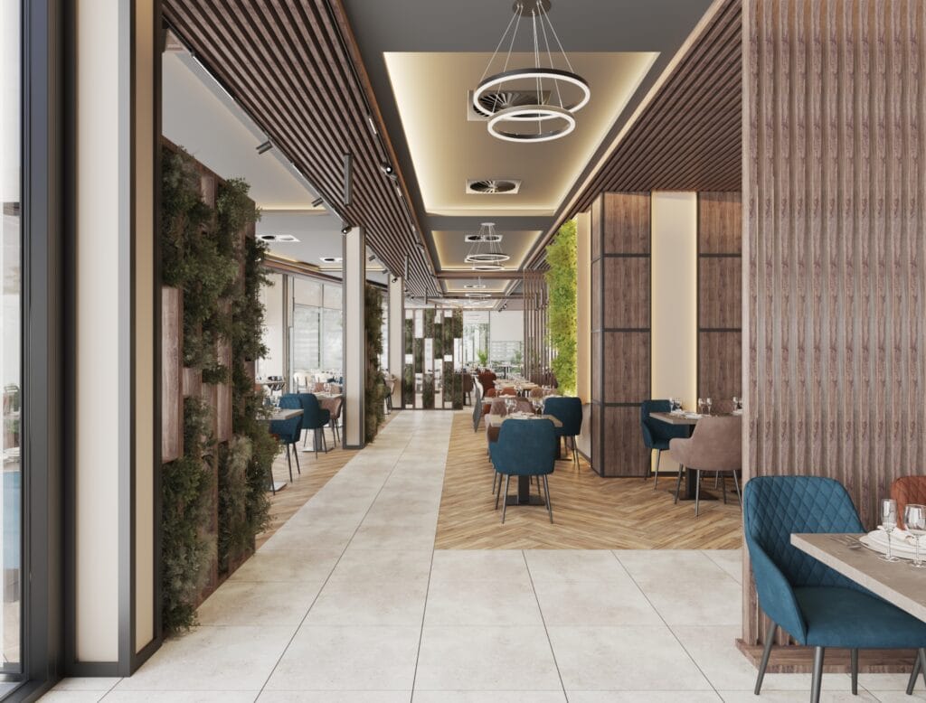 Restaurant corridor with dining tables and greenery wall decoration