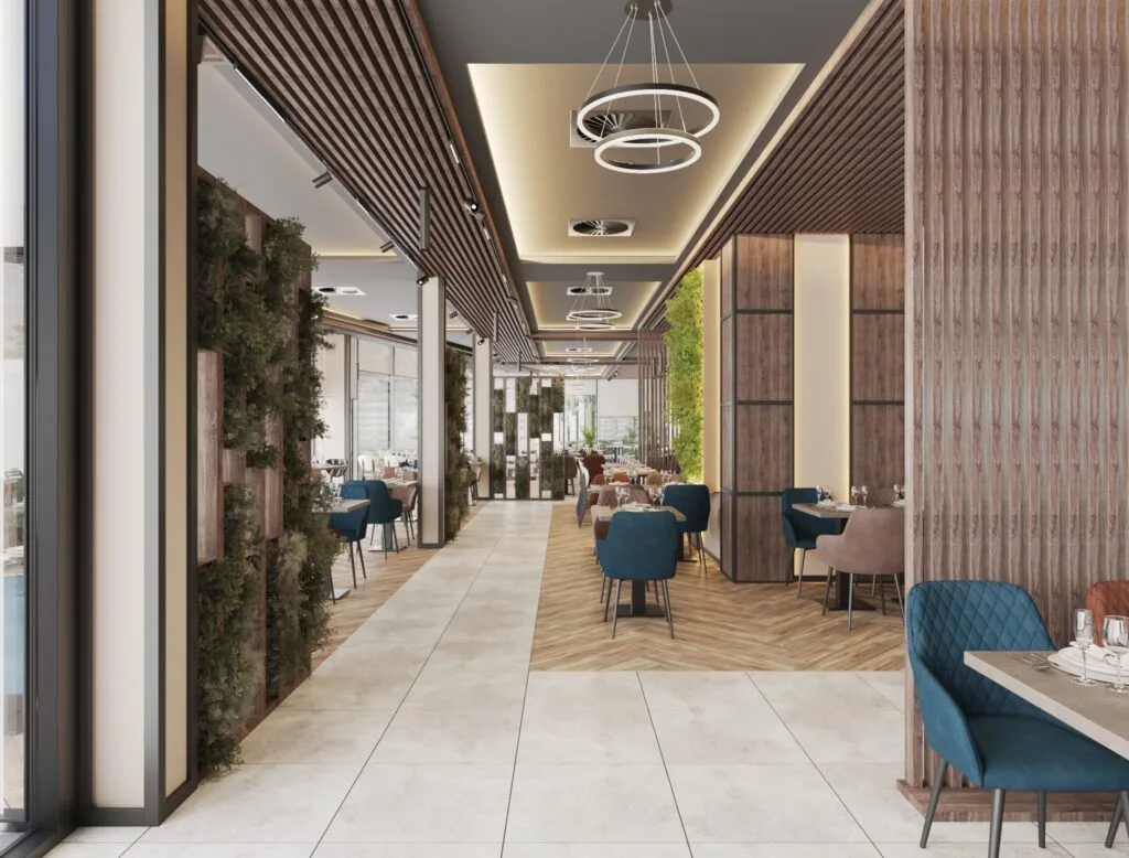 Restaurant corridor with dining tables and greenery wall decoration