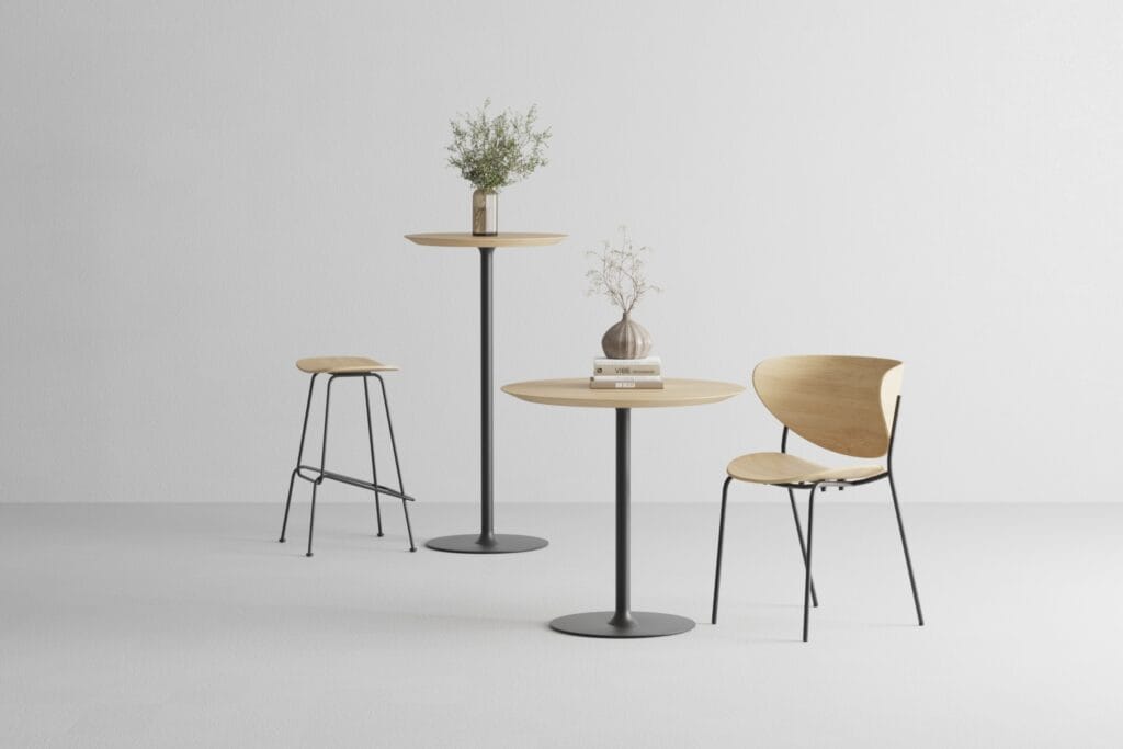 Set of round bistro tables with wooden tops and black metal bases styled with chairs – 3D render