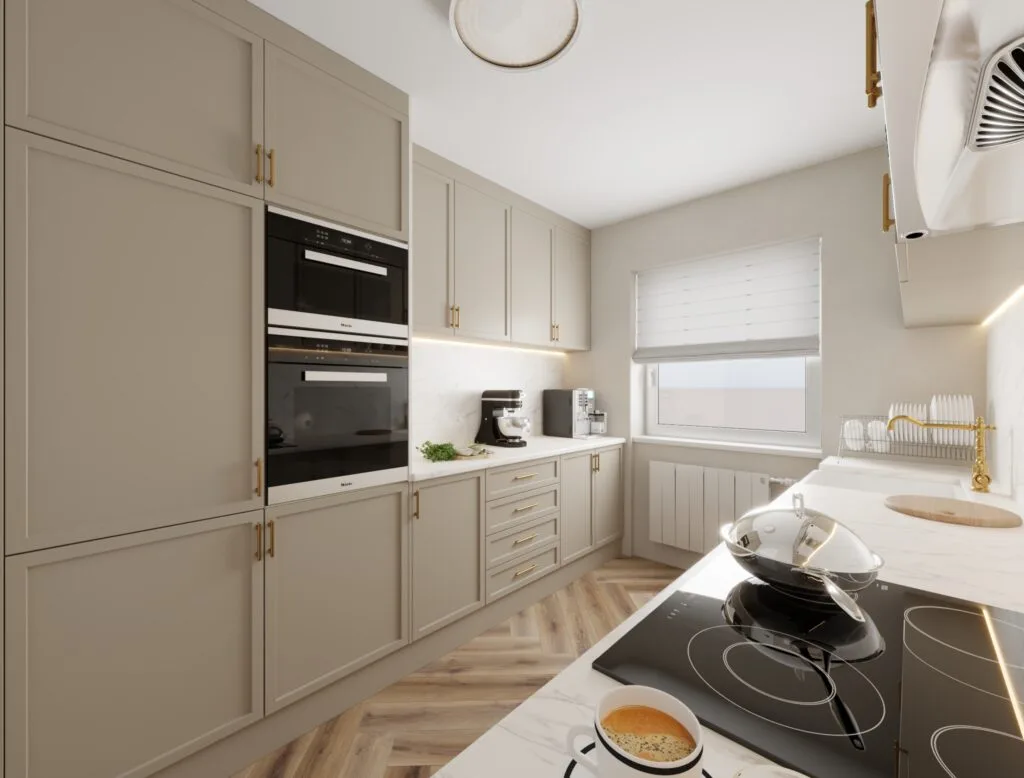 Spacious kitchen interior with oven tower and corner layout – Intervibe Studio