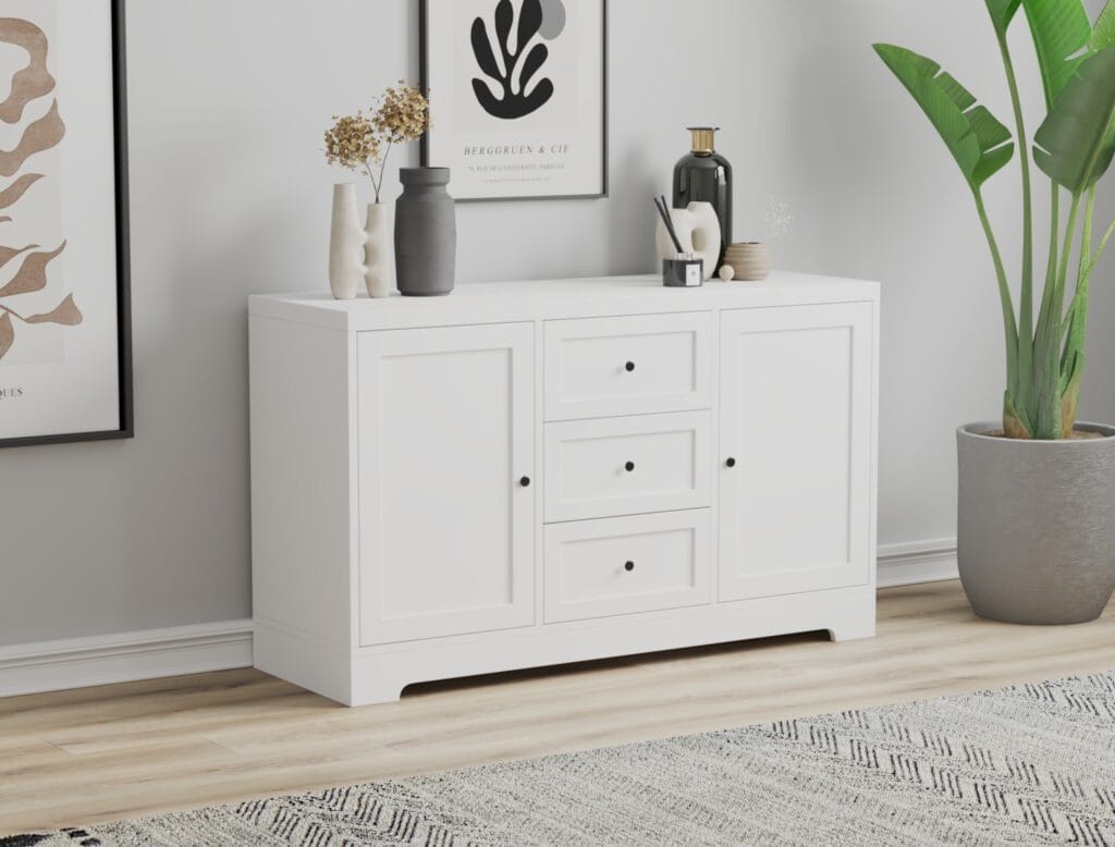 White chest of drawers with three large drawers.