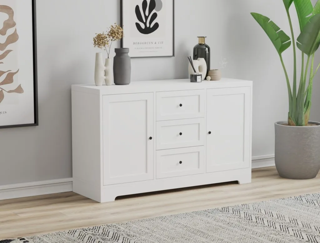 White chest of drawers with three large drawers.