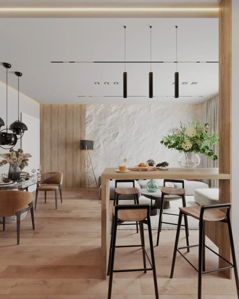 Modern kitchen breakfast bar connecting the dining and living areas of a compact apartment