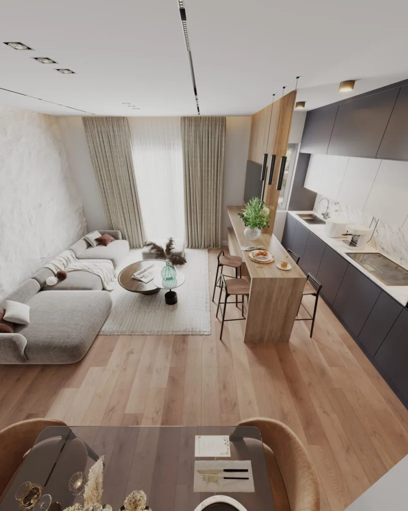 Elevated view of an open-plan living room, dining area and compact modern kitchen