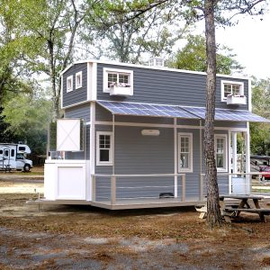 3D exterior visualization of a tiny house on wheels in natural surroundings