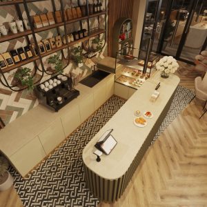 Café bar counter at night with decorative shelving, plants, and modern pendant lighting