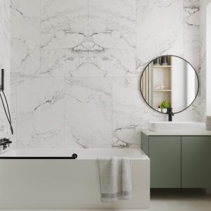 Contemporary bathroom with round mirror and green vanity – Intervibe Studio
