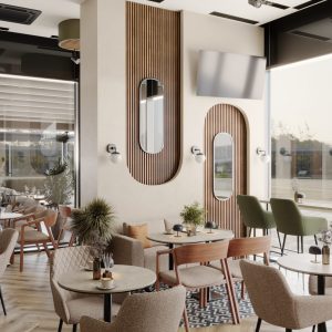 Modern café interior with round tables, beige chairs, and decorative wall mirrors